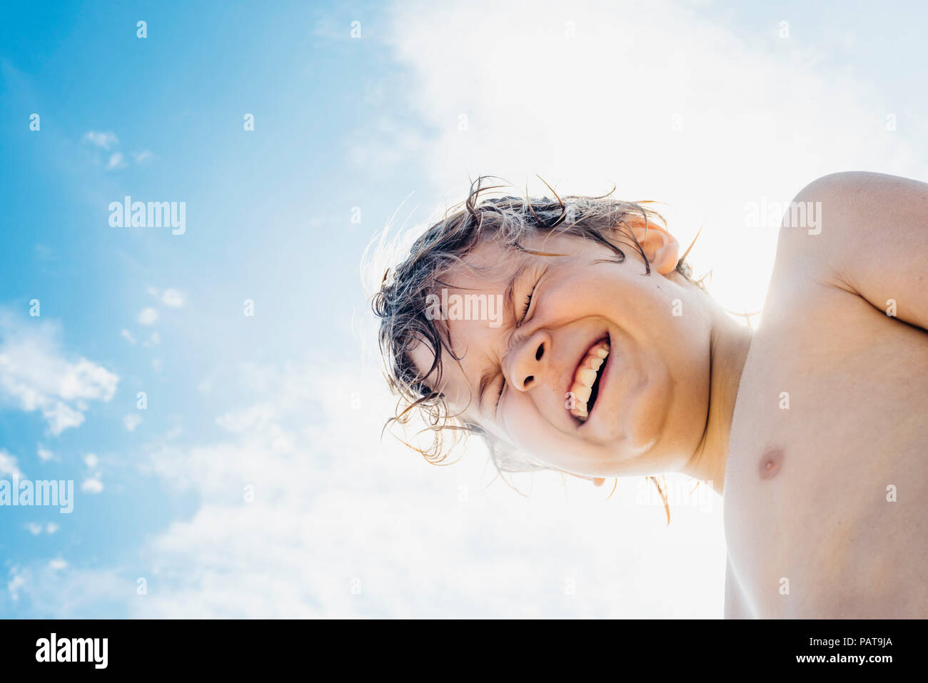 Portrait of happy boy outdoors Stock Photo