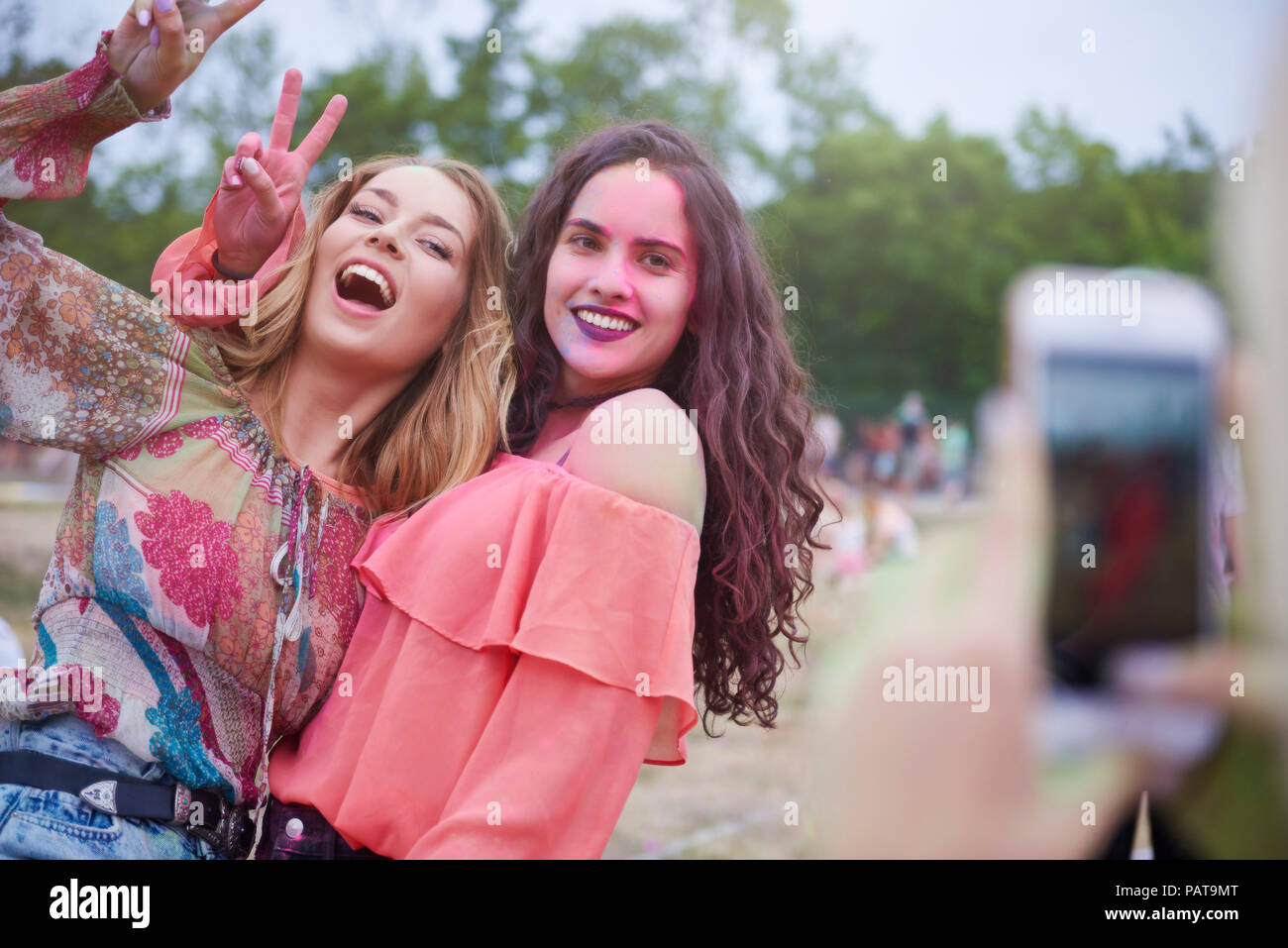 Portrait of happy women at the music festival, photographing Stock Photo