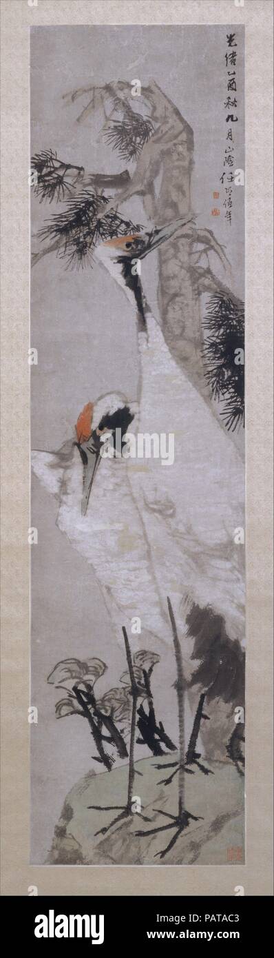 Cranes, Pine Tree, and Lichen. Artist: Ren Yi (Ren Bonian) (Chinese, 1840-1896). Culture: China. Dimensions: Image: 57 3/4 x 14 3/4 in. (146.7 x 37.5 cm)  Overall with mounting: 95 1/4 x 21 5/8 in. (241.9 x 54.9 cm)  Overall with knobs: 95 1/4 x 23 3/4 in. (241.9 x 60.3 cm). Date: dated 1885.  Ren Yi, the son of a rice merchant, was trained in a portrait shop. Ren developed a popular richly colored style for figures and for flower-and-bird and landscape paintings, becoming a leading artist in Shanghai by the 1870s, with a large circle of eminent friends and students, such as the literatus Wu C Stock Photo