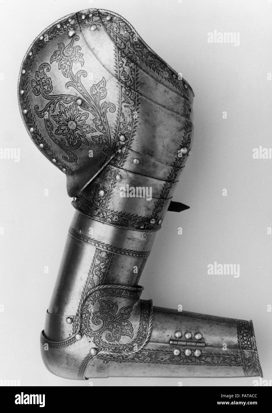 Elements of an Armor Garniture. Armorer: Attributed to Wolfgang Grosschedel (German, Landshut, active ca. 1517-62); Attributed to Franz Grosschedel (German, Landshut, recorded 1555-79). Culture: German, Landshut. Dimensions: right shoulder and arm defense (32.109.1a, b): H. approx. 28 in. (71.1 cm); W. approx. 10 in. (25.4 cm); Wt. 5 lb. 9 oz. (2523.1 g); left shoulder and arm defense (32.109.2a, b): L. approx. 28 in. (71.1 cm); W. approx. 10 in. (25.4 cm); Wt. 5 lb. 6 oz. (2438.1 g); right thigh and knee defense (32.109.3a-c): L. 20 in. (50.8 cm); W. 8 1/2 in. (21.6 cm); Wt. 3 lb. 3 oz. (1445 Stock Photo