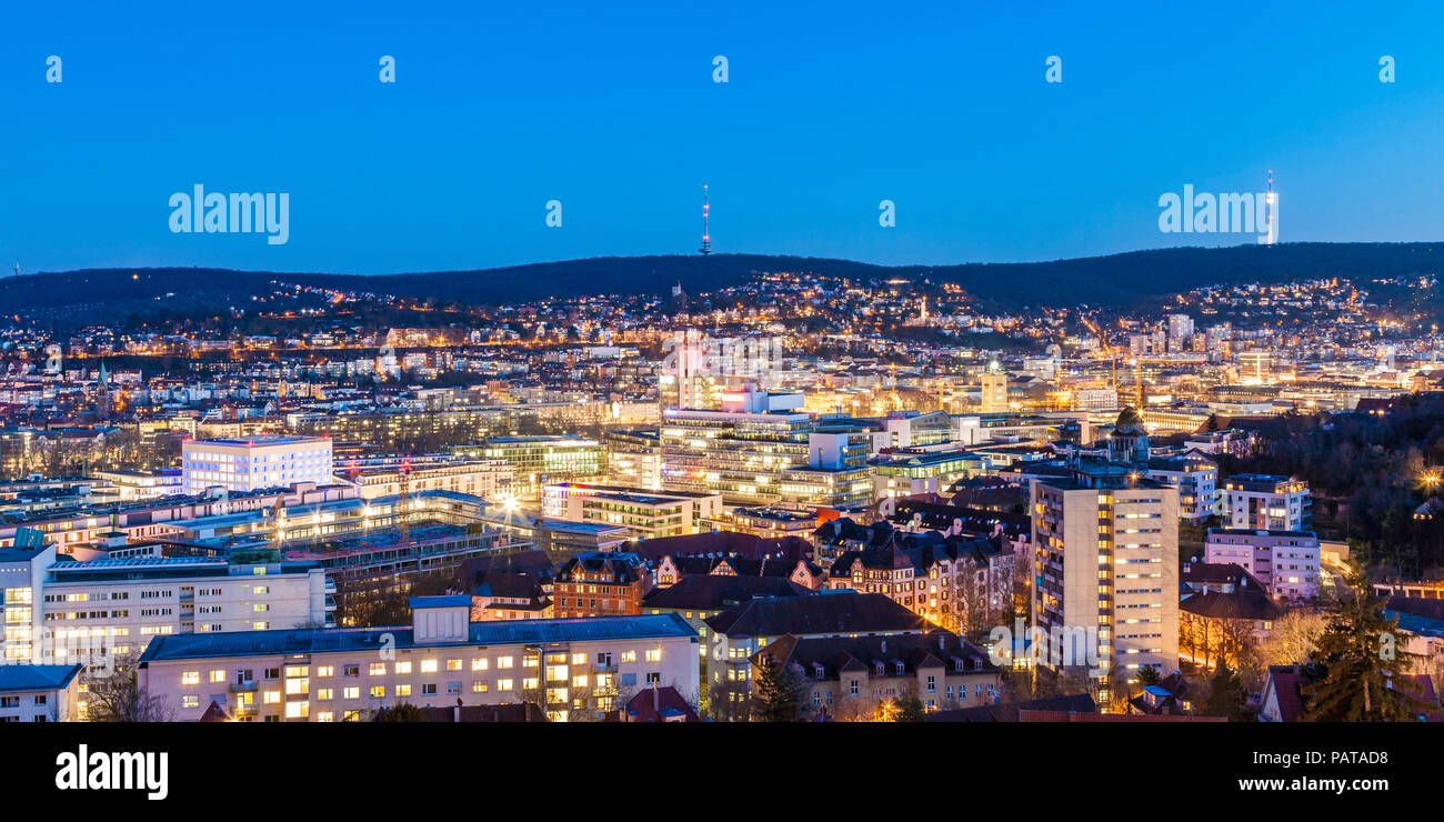 Germany, Stuttgart, panoramic cityscape with TV tower in the evening, blue hour Stock Photo