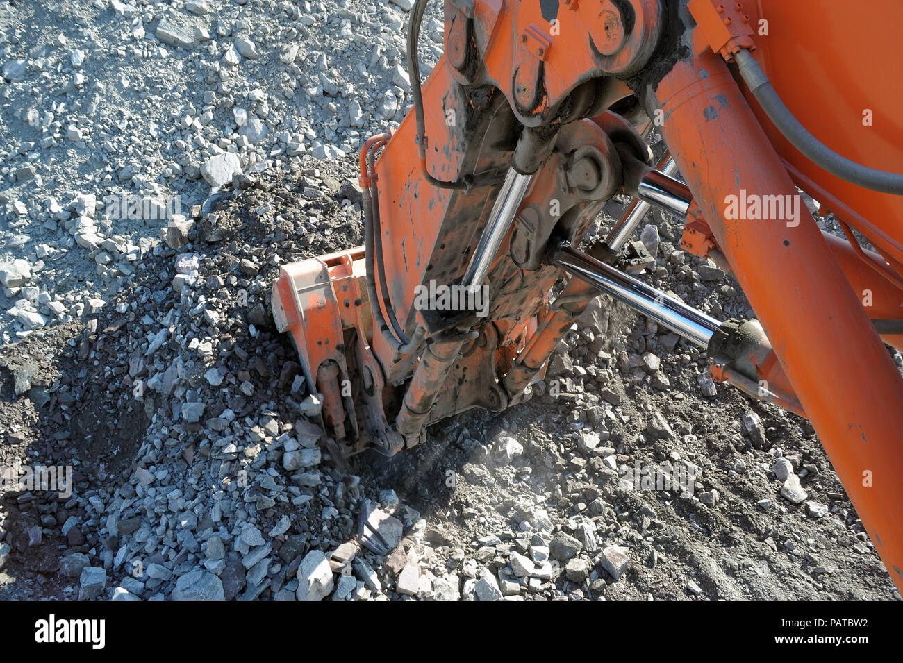 excavator bucket in the career of iron ore Stock Photo