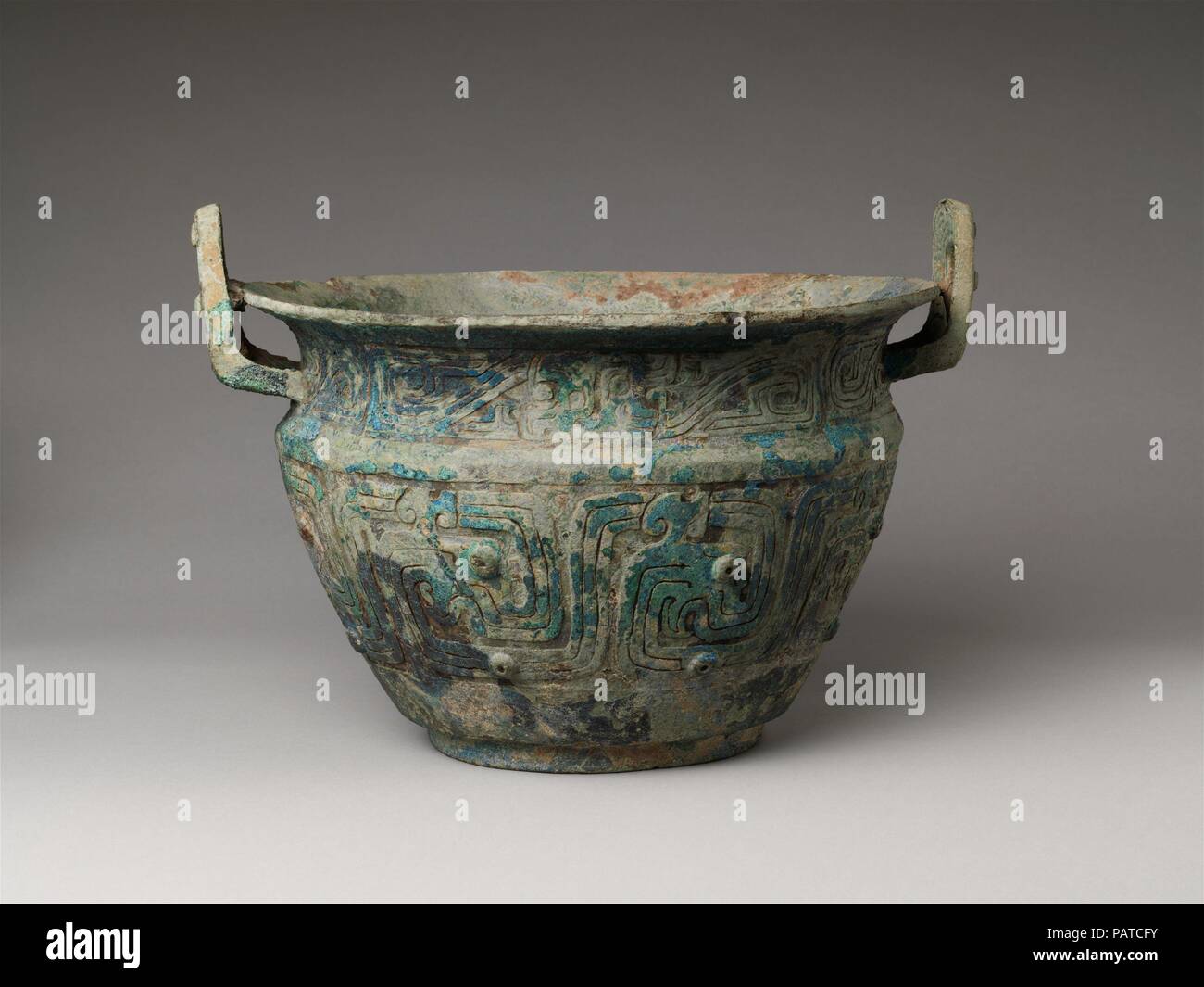 Part of a Steamer (Zeng). Culture: China. Dimensions: H. 9 1/4 in. (23.5 cm); W. at handles 13 5/8 in. (34.6 cm); Diam. of rim 12 1/4 in. (31.1 cm). Date: late 9th-early 8th century B.C.. Museum: Metropolitan Museum of Art, New York, USA. Stock Photo