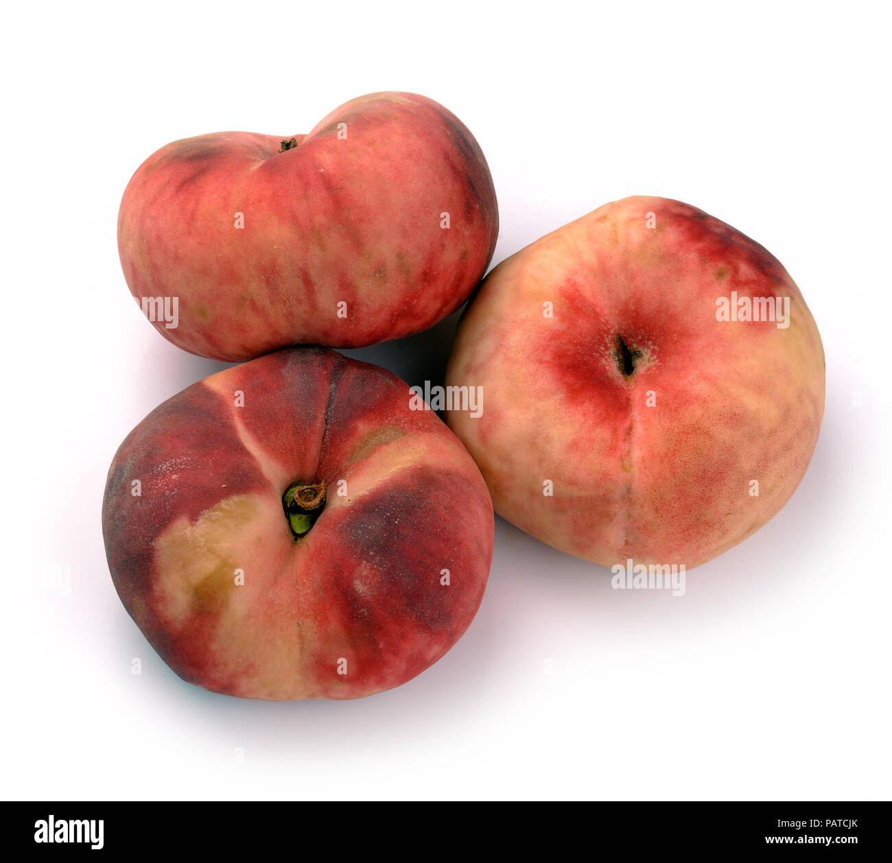 Chinese flat peaches on a white background Stock Photo Alamy