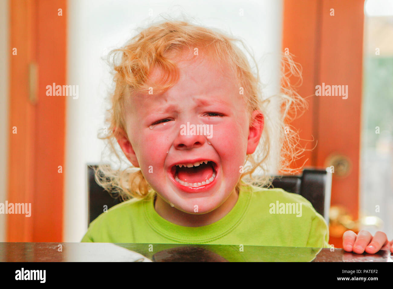 Child crying with impatience Stock Photo