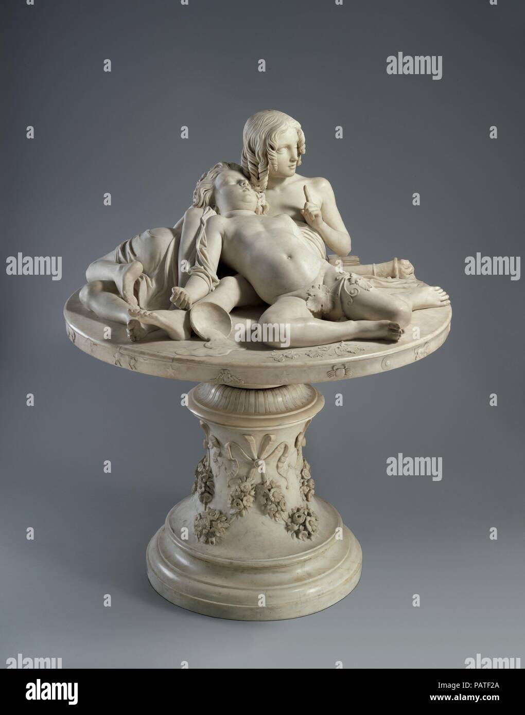 The Demidoff Table. Artist: Lorenzo Bartolini (Italian, 1777-1850). Culture: Italian, Florence. Dimensions: Overall (confirmed): H. 64 3/8 x W. 51 1/4 x Diam. 49 3/4 x in. (163.5 x 130.2 x 126.4 cm). Patron: Commissioned by Prince Anatole Demidov (1845-1870). Date: 1845.  Commissioned by Count Anatoly Nicolaevich Demidoff. The subject is a complex, cosmological allegory best described in the sculptor's own words: 'Stretched out upon the plan of the world is Cupid, god of generation, sustaining and watching over the symbolic genius of dissolute wealth without virtue, who snores in his sleep . . Stock Photo