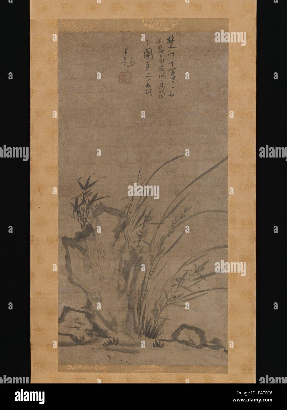 Orchids, Bamboo, Briars, and Rocks. Artist: Tesshu Tokusai (Japanese, died 1366). Culture: Japan. Dimensions: Image: 28 3/8 × 14 1/2 in. (72 × 36.8 cm)  Overall with mounting: 60 1/16 × 19 5/16 in. (152.5 × 49 cm)  Overall with knobs: 60 1/16 × 21 in. (152.5 × 53.4 cm). Date: mid-14th century.  In medieval Japan, ink paintings that combined orchids with briars, bamboo, and rocks were most commonly associated with the Yuan-dynasty Chinese painter Xuechuang Puming (active mid-14th century), whom Tesshu Tokusai--a Zen monk and accomplished poet and painter-- may have encountered during an extende Stock Photo