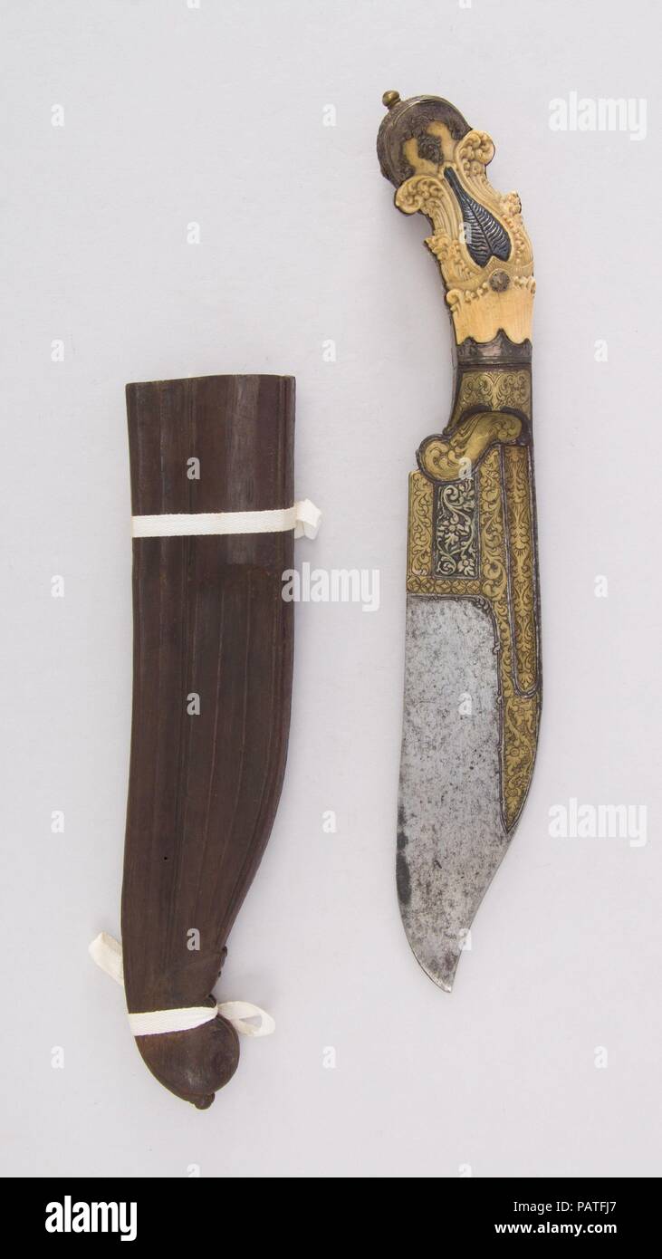 Knife (Piha Kaetta) with Sheath. Culture: Sri Lankan. Dimensions: H. with sheath 14 in. (35.6 cm); H. without sheath 12 3/4 in. (32.4 cm); W. 2 1/4 in. (5.7 cm); Wt. 1 lb. 6.9 oz. (649.2 g); Wt. of sheath 3.4 oz. (96.4 g). Date: 18th-19th century. Museum: Metropolitan Museum of Art, New York, USA. Stock Photo