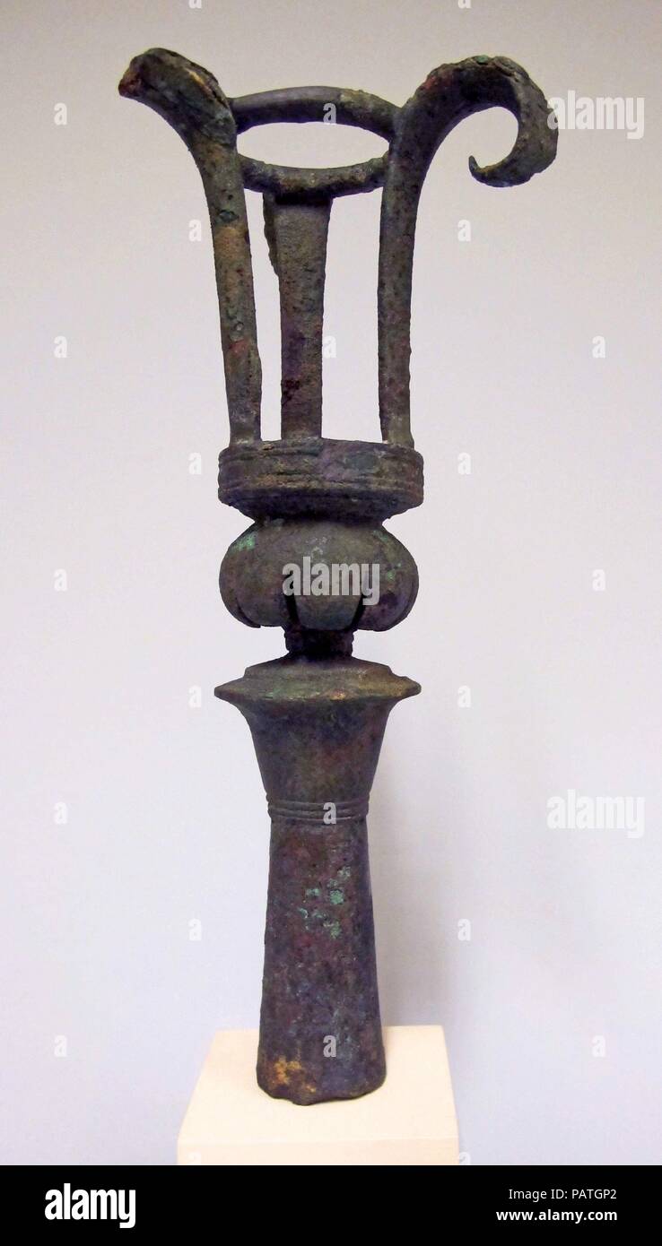 Bronze lampstand. Culture: Cypriot. Dimensions: 11 1/4in. (28.6cm). Date: 6th century B.C..  Short stem decorated with one row of lotus petals. Museum: Metropolitan Museum of Art, New York, USA. Stock Photo