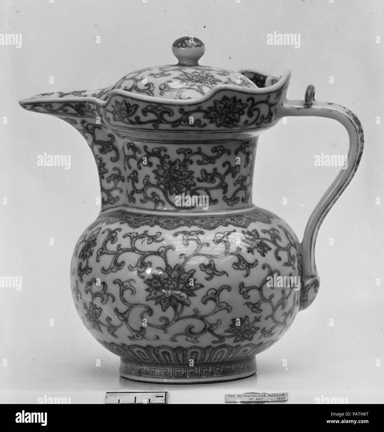 Ewer in Shape of Tibetan Monk's Cap. Culture: China. Dimensions: H. with cover: 5 3/4 in. (14.6 cm); Diam. 3 3/4 in. (9.5 cm). Date: mid-18th century.  This shape was introduced to the repertory of Chinese ceramics in the fourteenth century due in part to the prominence of Tibetan monks and practices at the Mongol Yuan (1271-1368) court. Museum: Metropolitan Museum of Art, New York, USA. Stock Photo