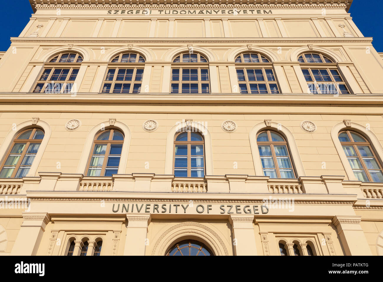 Main Building of Szeged University, on the Dugonics Ter Square, taken during a summer afternoon, with the word 'Szeged university' written on the fron Stock Photo