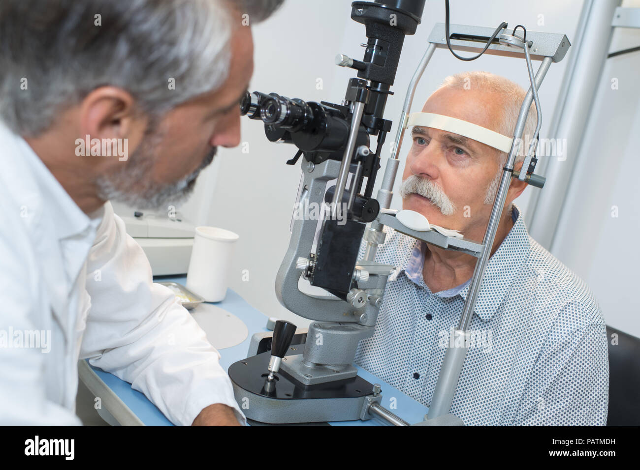 elderly man with glaucoma at the optician for optical examination Stock ...