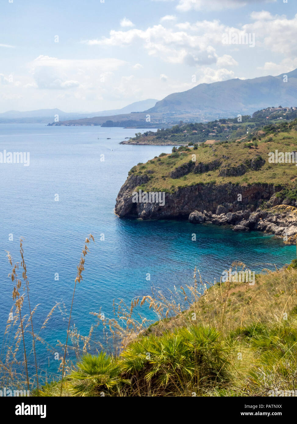 Boats sailing past in Zingaro Nature Reserve, a scenic coastal reserve