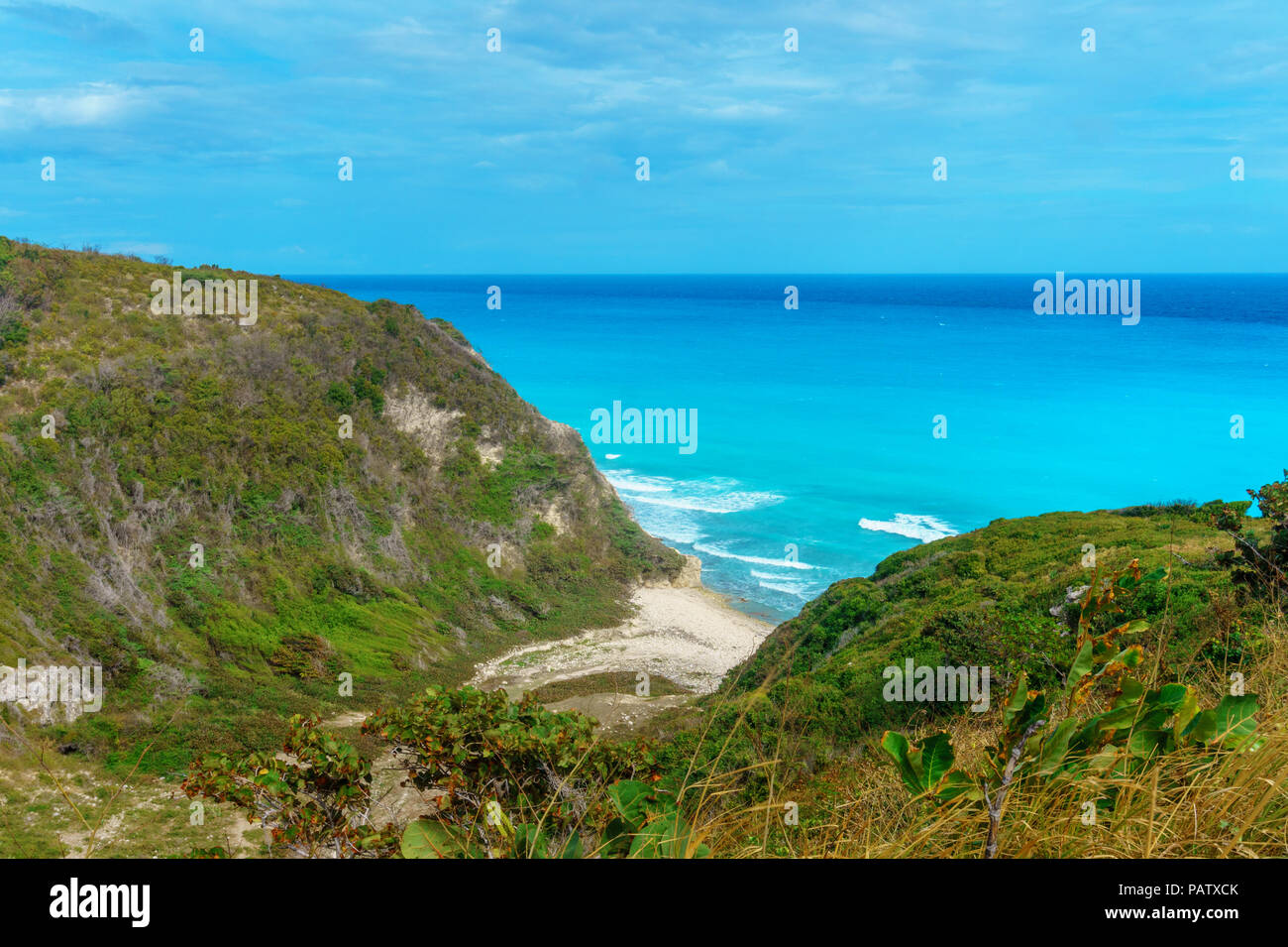 hidden picturesque Caribbean Bay, azure sea and green cliffs. Dominican Republic Stock Photo