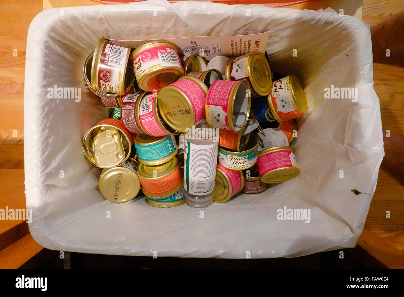 Empty cat food cans in a kitchen recycling bin Stock Photo Alamy