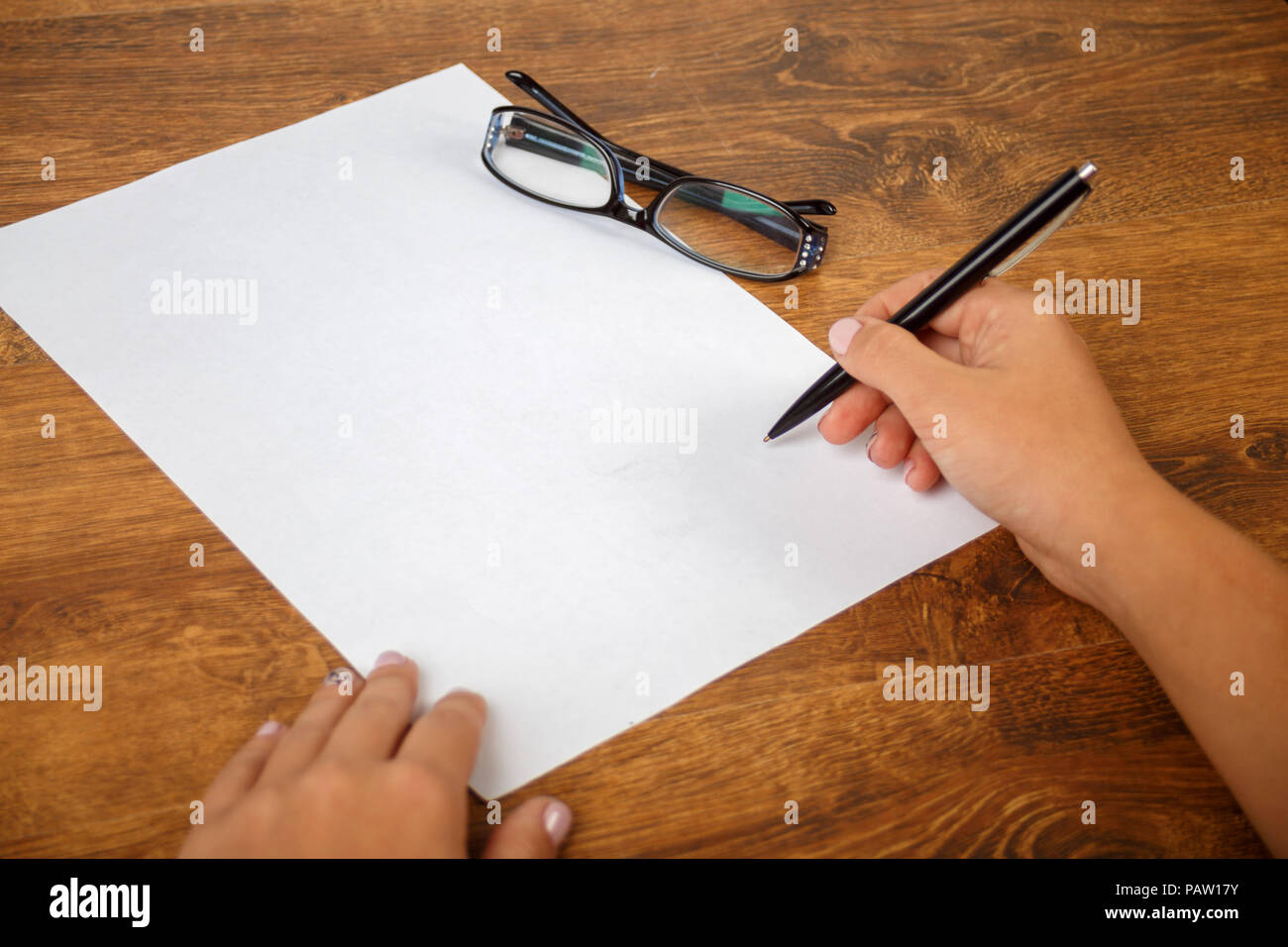 signing a contract or document, writing an essay, right female hand ...