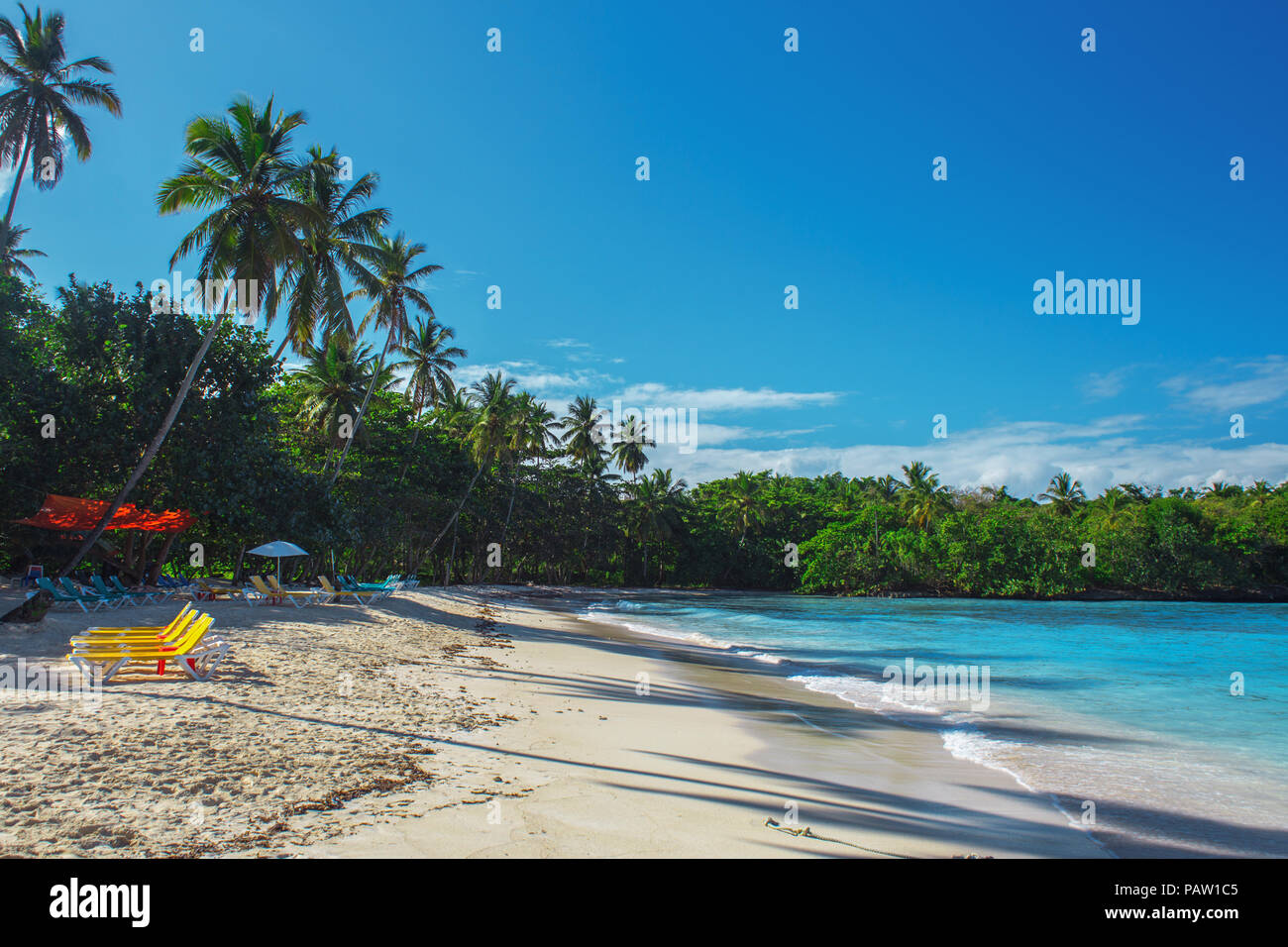 beautiful Caribbean beach with white sand and deckchairs. Dominican Republic Stock Photo