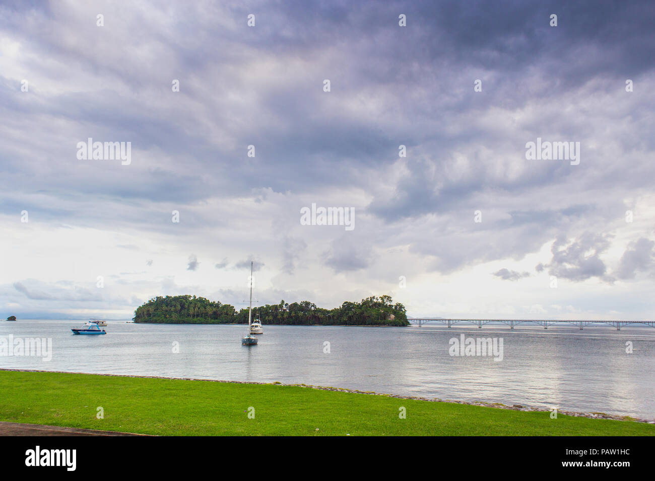 sail boats near the cost with palm trees in cloudy weather. Samana, Dominican Republic Stock Photo
