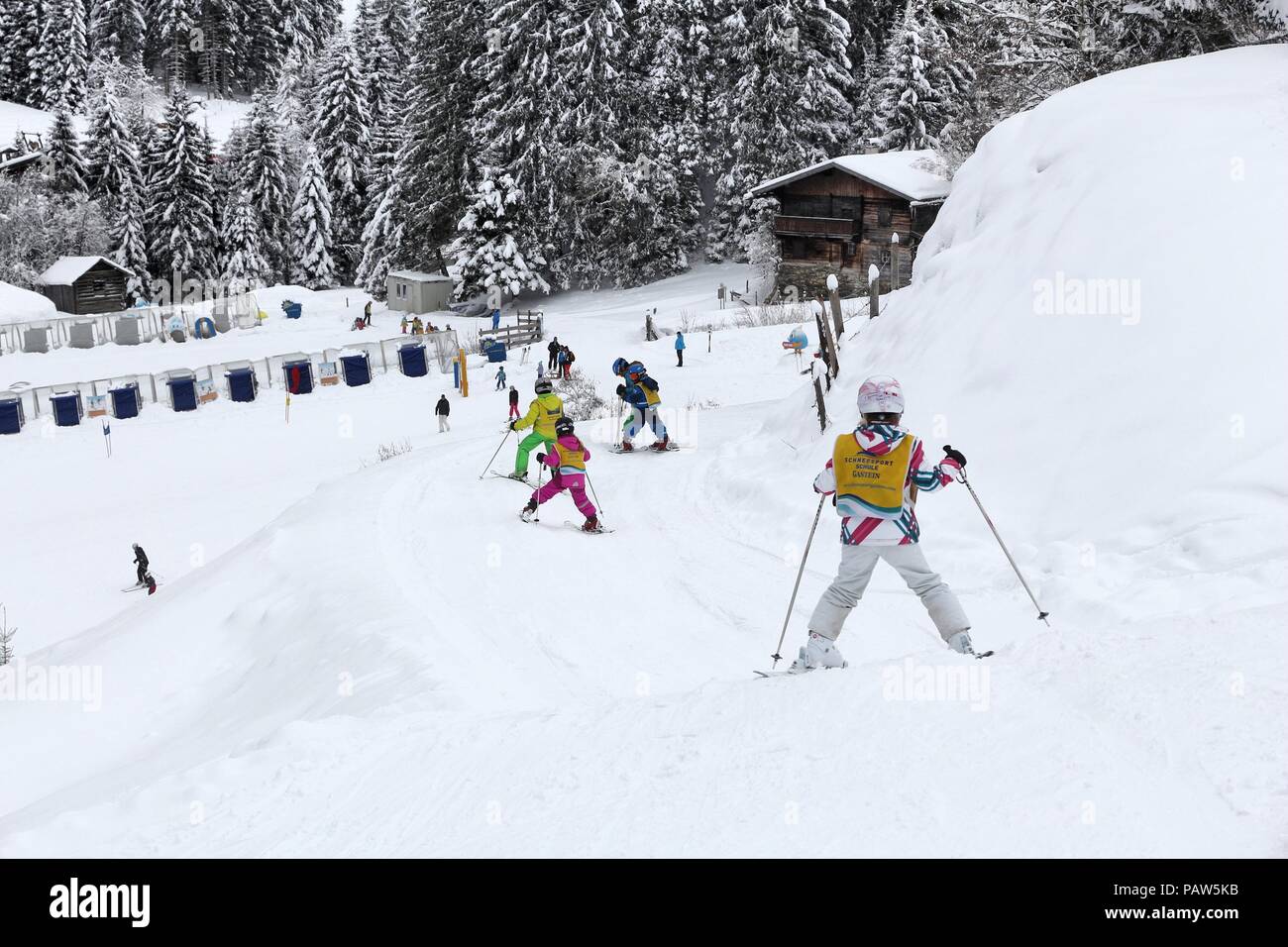 BAD HOFGASTEIN, AUSTRIA - MARCH 7, 2016: Children learn at skiing school in Bad Hofgastein. It is part of Ski Amade, one of largest ski regions in Eur Stock Photo