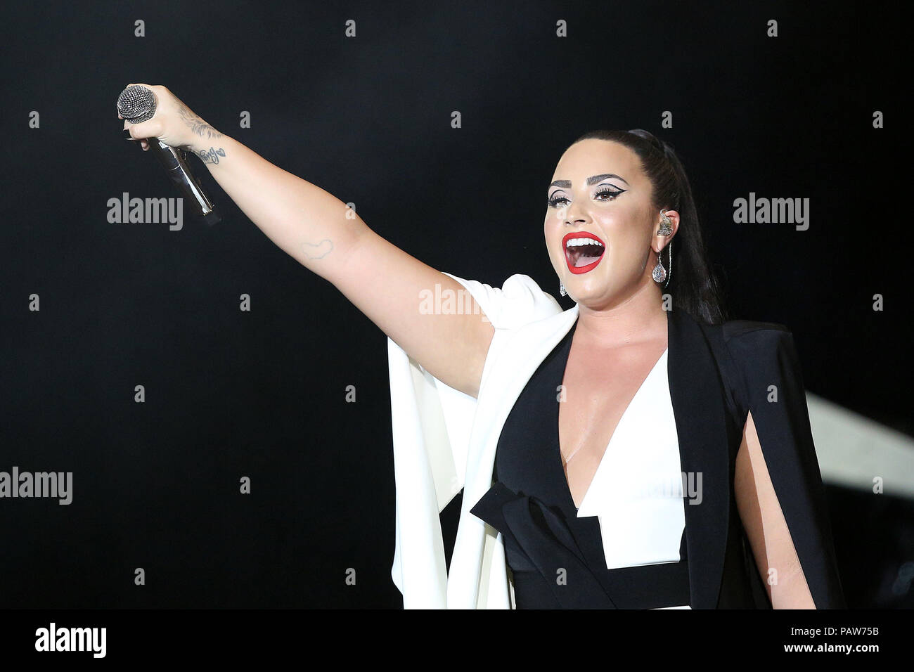 July 24, 2018 - FILE - Demi Lovato has been rushed to a hospital in Los Angeles after allegedly overdosing on heroin. A law enforcement source confirmed that the overdose occurred at Lovato's home and that she was found unconscious before being given Narcan and transported to the hospital. Lovato, 25, has been incredibly open about her struggles with alcohol and drugs, and earlier this year debuted her single 'Sober' in which she detailed her battles and path to recovery. PICTURED: June 24, 2018 - Lisbon, Portugal - US singer DEMI LOVATO performs at the Rock in Rio Lisboa 2018 music festival i Stock Photo