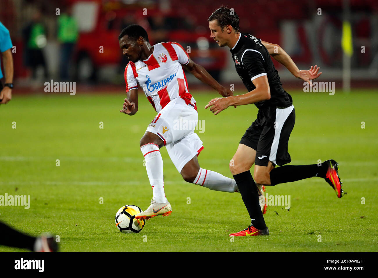 Belgrade, Serbia. 17th July, 2018. Crvena Zvezda's Milan Pavkov (L) and El  Fardou Ben Nabouhane celebrate during the first qualifying round UEFA Champions  League football match between Crvena Zvezda and Spartaks in