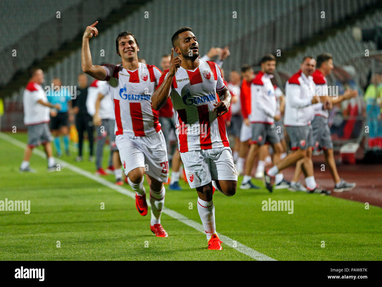 Belgrade. 24th July, 2018. Crvena Zvezda's Filip Stojkovic (front L) and  Lorenzo Ebecilio (front R) celebrate a goal during the UEFA Champions League  second qualifying round football match between Crvena Zvezda and