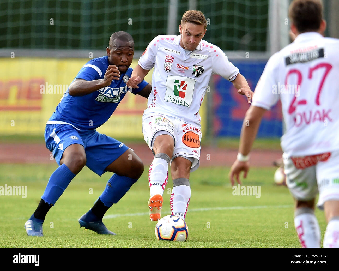 Wolfsberger, Austria, 24 July 2018. WAC's Gschweidl tackled by Udinese's Samir during the pre season friendly football match between RZ Pellets WAC and Udinese Calcio at Lavanttal Arena. photo Simone Ferraro / Alamy Live News Stock Photo