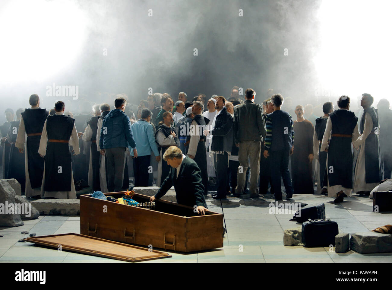 HANDOUT - 21 July 2018, Germany, Bayreuth: 'Parsifal', Andreas Schlager  in the role of Parsifal and a choir. The opera by Richard Wagner premiers at the Bayreuth Festival 2018 on 26 July. Photo: Enrico Nawrath/Festspiele Bayreuth/dpa - ATTENTION: editorial use only and only if the credit mentioned above is referenced in full Stock Photo