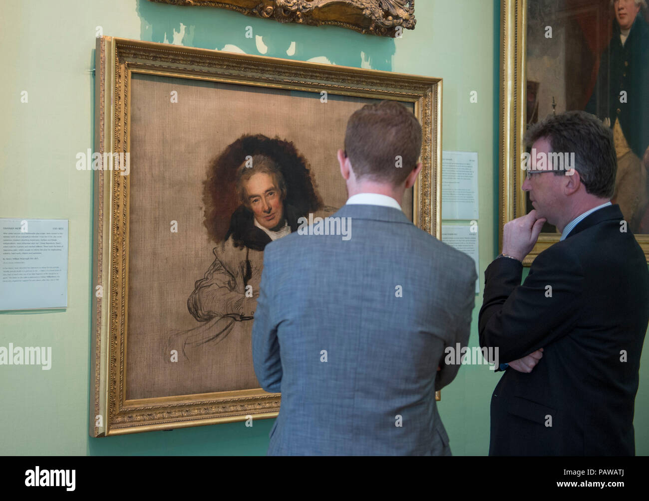 National Portrait Gallery, London, UK. 25 July, 2018. Jeremy Wright, Culture Secretary (right) and Dr Nicholas Cullinan, Director, National Portrait Gallery (left) view Sir Thomas Lawrence’s famous portrait of William Wilberforce, which will travel to Hull, the place of his birth, for the first time as part of ‘Coming Home’. Lawrence’s unfinished portrait of Wilberforce, was one of the first works acquired by the National Portrait Gallery when it was established in 1856. The work will go on display in the Ferens Art Gallery in Hull in 2019. Credit: Malcolm Park/Alamy Live News. Stock Photo