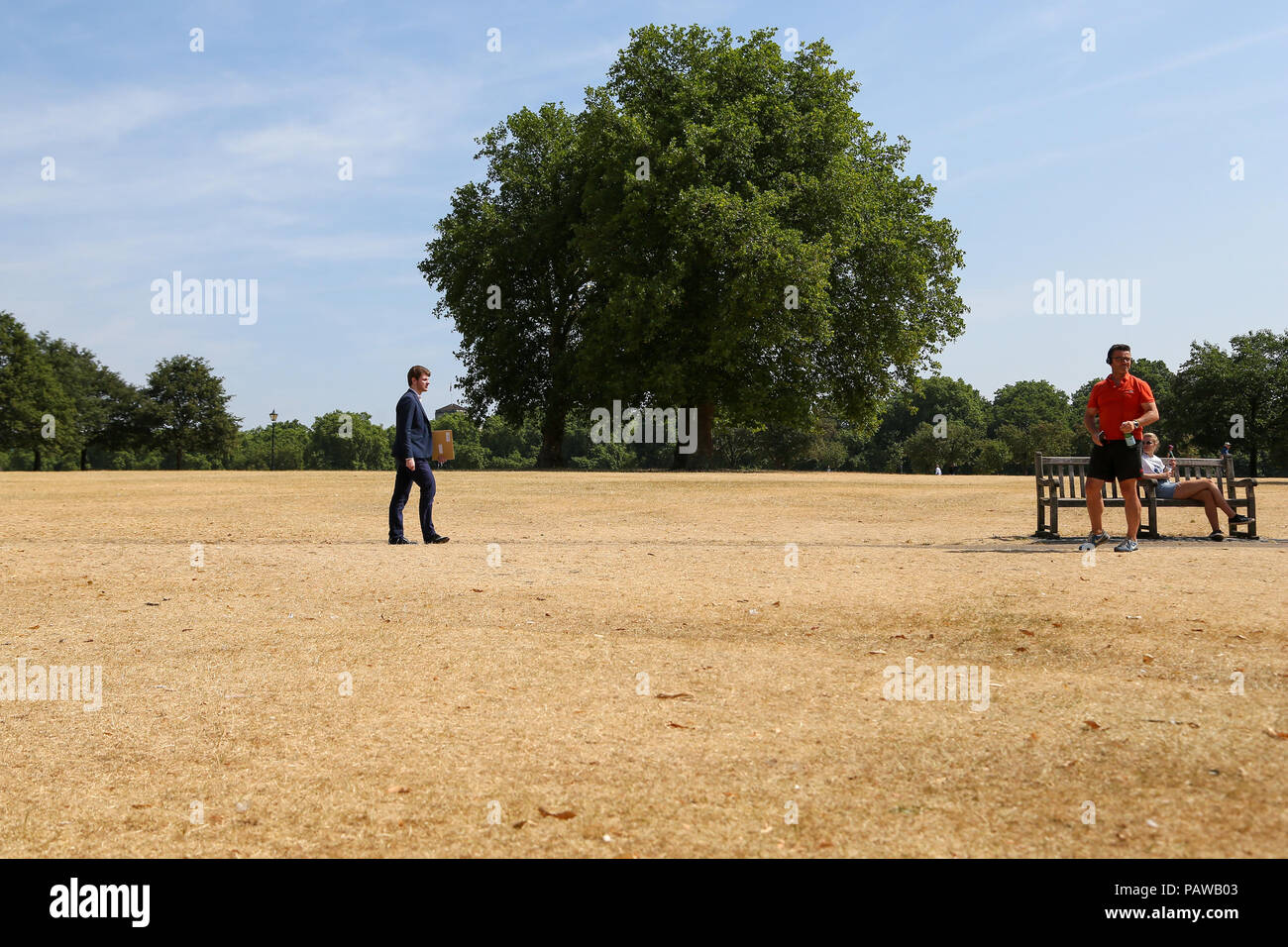 Man wearing a suit in hot weather hires stock photography and images