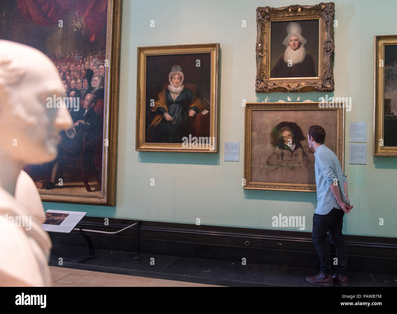 National Portrait Gallery, London, UK. 25 July, 2018. A member of Gallery staff views Sir Thomas Lawrence’s famous portrait of William Wilberforce, which will travel to Hull, the place of his birth, for the first time as part of ‘Coming Home’. Lawrence’s unfinished portrait of Wilberforce, was one of the first works acquired by the National Portrait Gallery when it was established in 1856. The work will go on display in the Ferens Art Gallery in Hull in 2019. Credit: Malcolm Park/Alamy Live News. Stock Photo