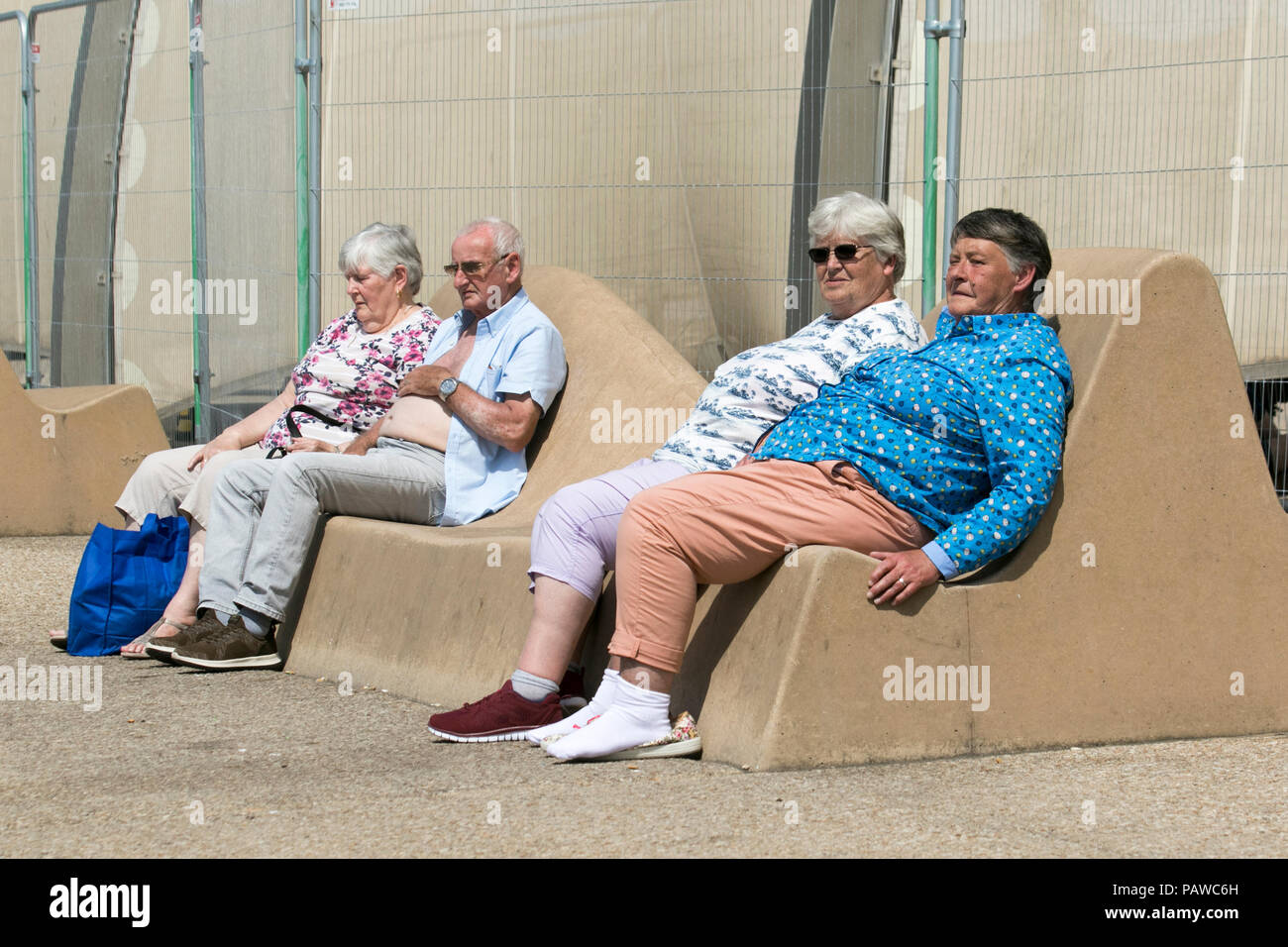 Seated man reclining woman hi-res stock photography and images - Alamy