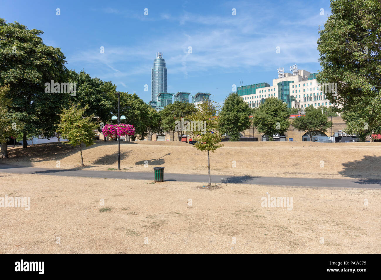 Vauxhall, London, UK, 25 July 2018. Vauxhall Pleasure Gardens, London; UK Weather - Grass Has Turned Yellow and Looks  Like Straw Due to the Current Summer Heatwave Stock Photo