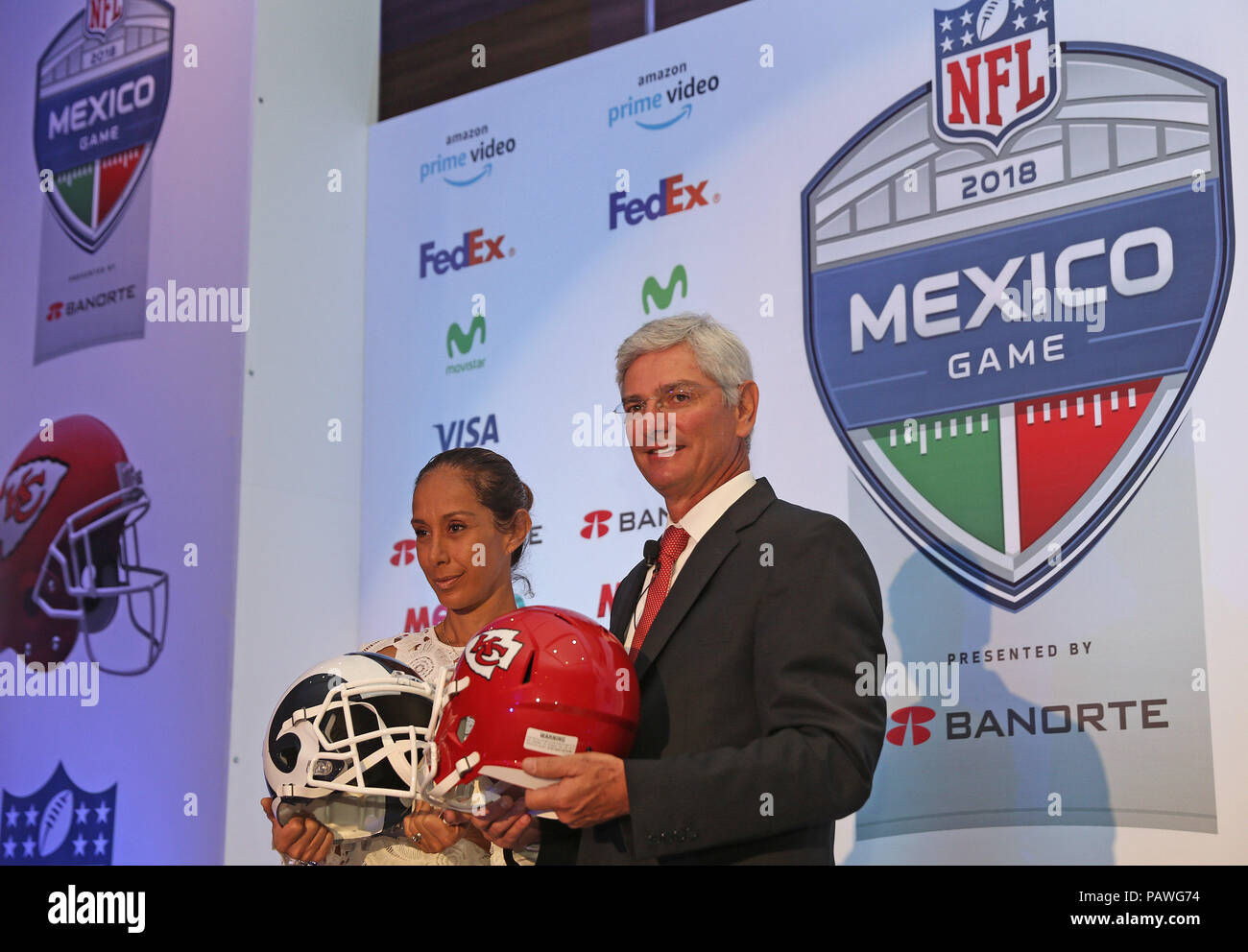 The Director Of The Nfl In Mexico, Arturo Olive, Poses With The Director Of Marketing Of The Banorte Group, Carla Juan Chelala (L), At The Start Of A Press Conference In Mexico