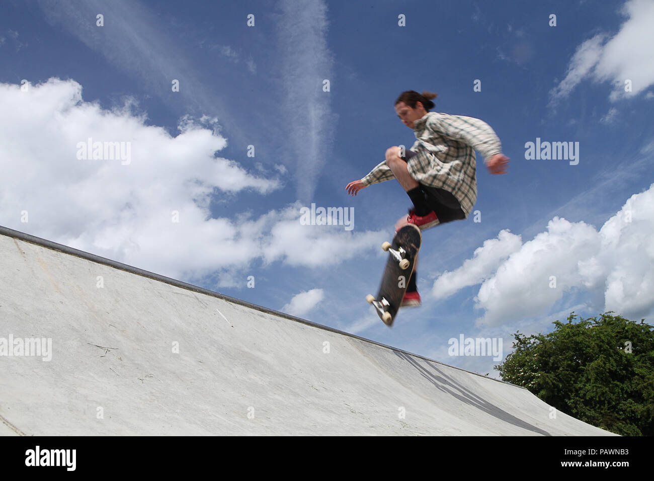 Skateboarding at a skatepark Stock Photo