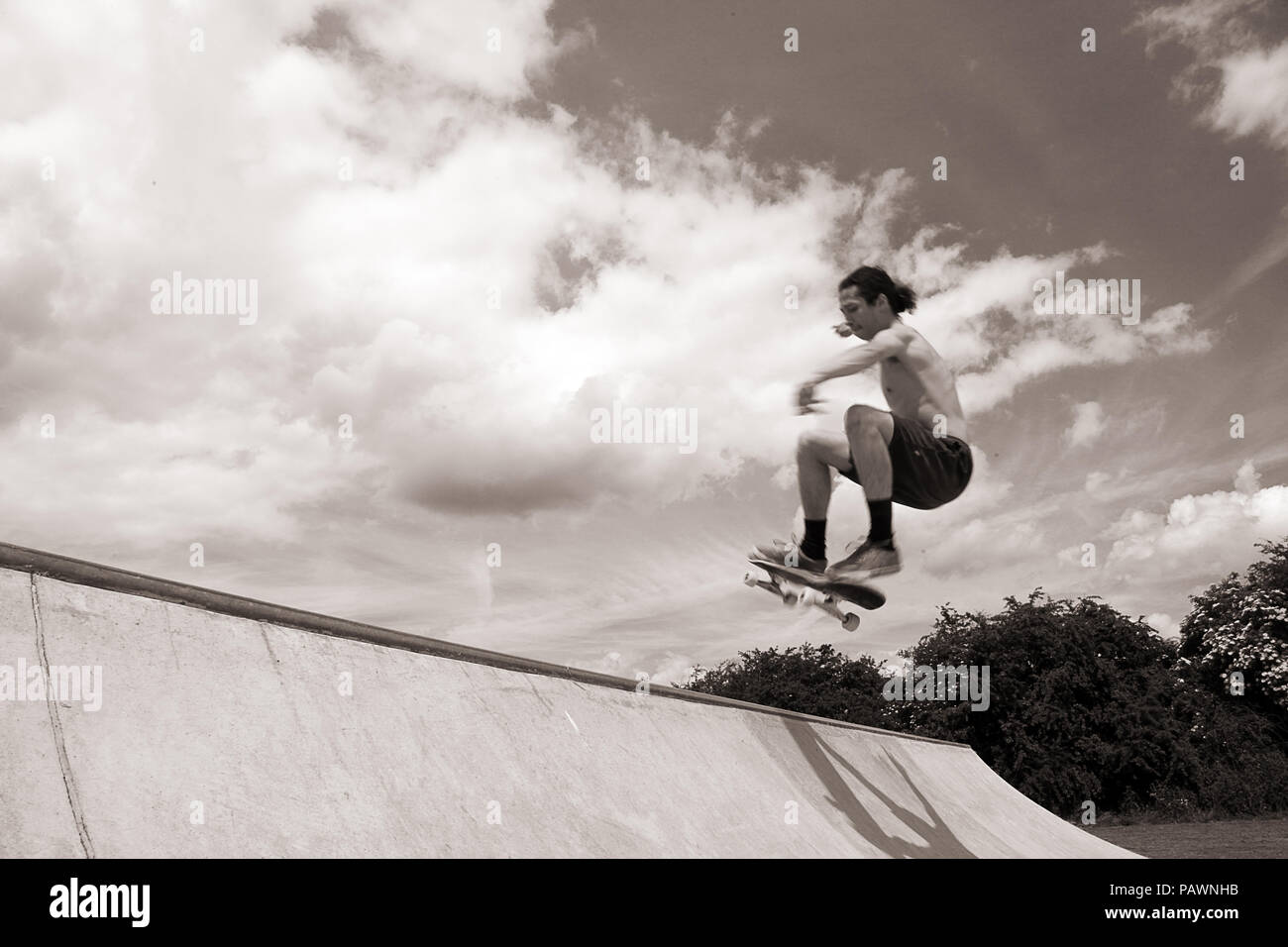 Skateboarding at a skatepark Stock Photo