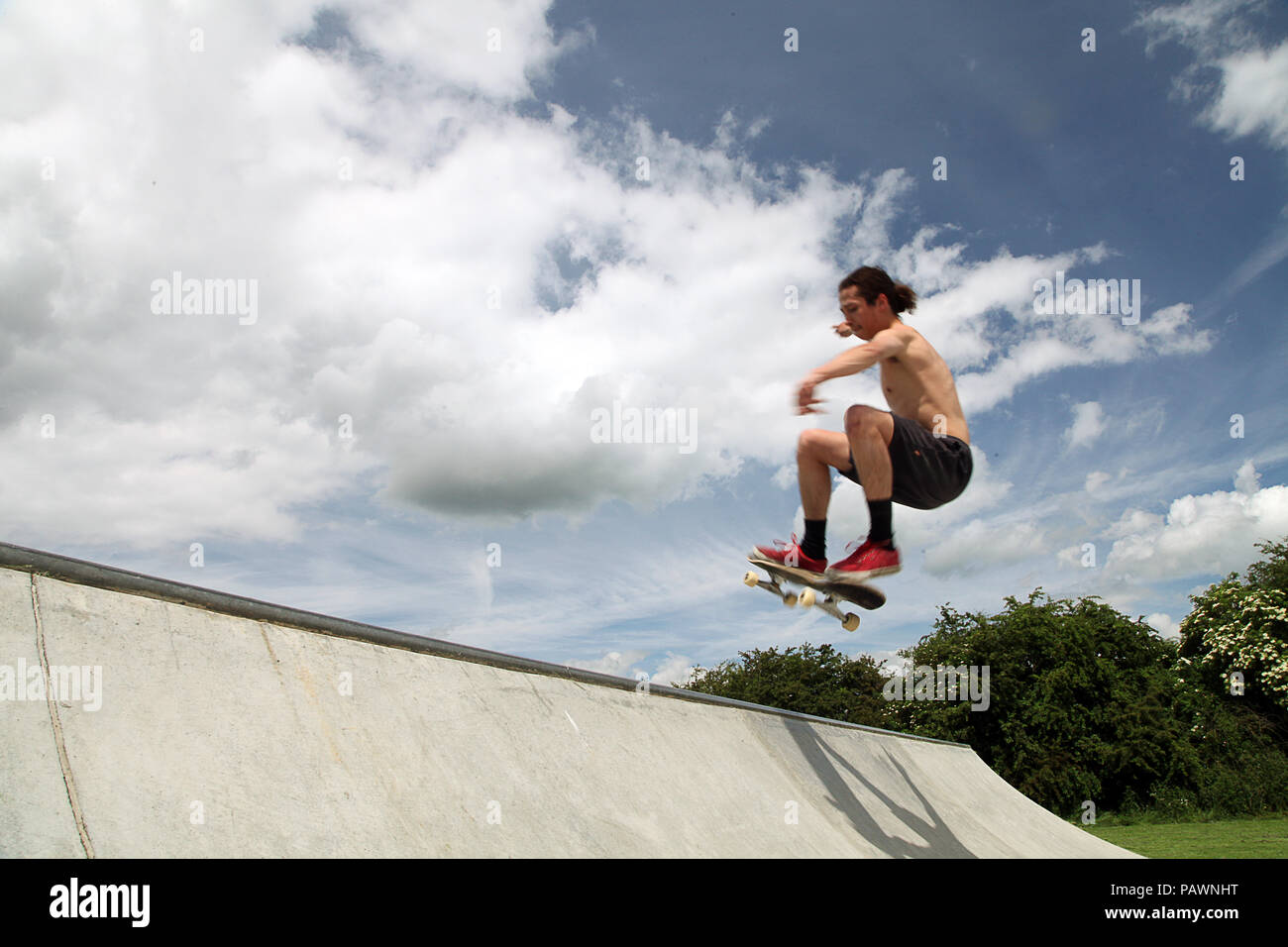 Skateboarding at a skatepark Stock Photo