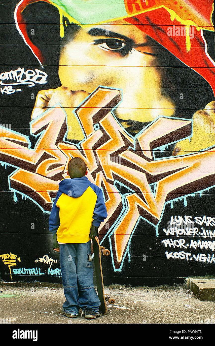 young skateboarder urban graffiti Stock Photo