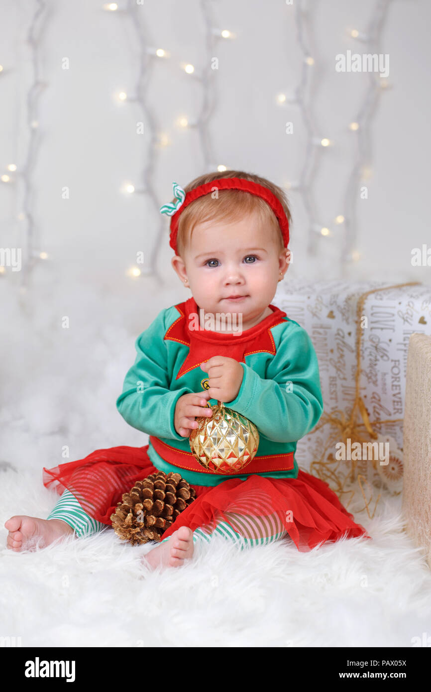 Portrait of blonde Caucasian baby girl with blue eyes in elf costume celebrating Christmas or New Year holiday Stock Photo Alamy