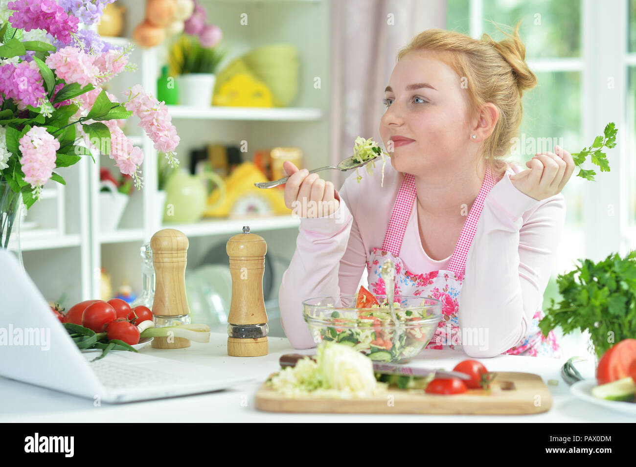 Cute teen girl using laptop Stock Photo - Alamy