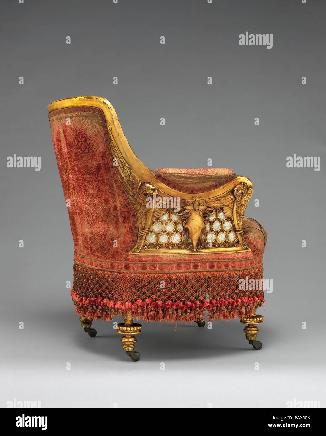 Armchair. Culture: American. Dimensions: 33 1/2 x 27 x 28 in. (85.1 x 68.6 x 71.1 cm). Maker: Herter Brothers (German, active New York, 1864-1906). Date: 1881-82.  William H. Vanderbilt, son of Cornelius 'Commodore' Vanderbilt, inherited a vast fortune and a lucrative transport business, which he expanded exponentially, becoming one of the wealthiest men in America. In 1879, to mark his elevated social and economic status, he built a mansion that spanned an entire city block on Fifth Avenue, between Fifty-First and Fifty-Second Streets. He commissioned Herter Brothers, one of the premier cabin Stock Photo