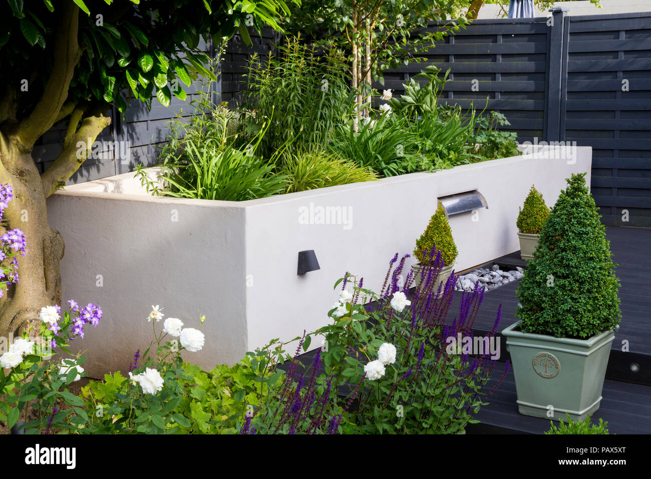 Overview of herbaceous borders and composite decking with water blade