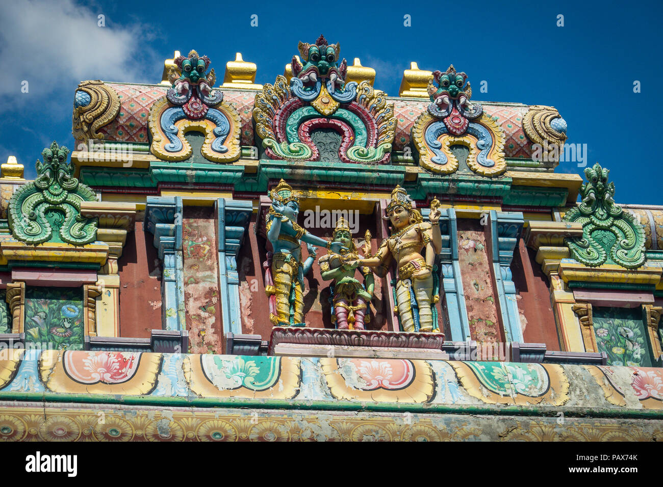 Colorful relief patterns and statues on the  Sri Thendayuthapani Hindu Temple near River Valley Road, Singapore Stock Photo