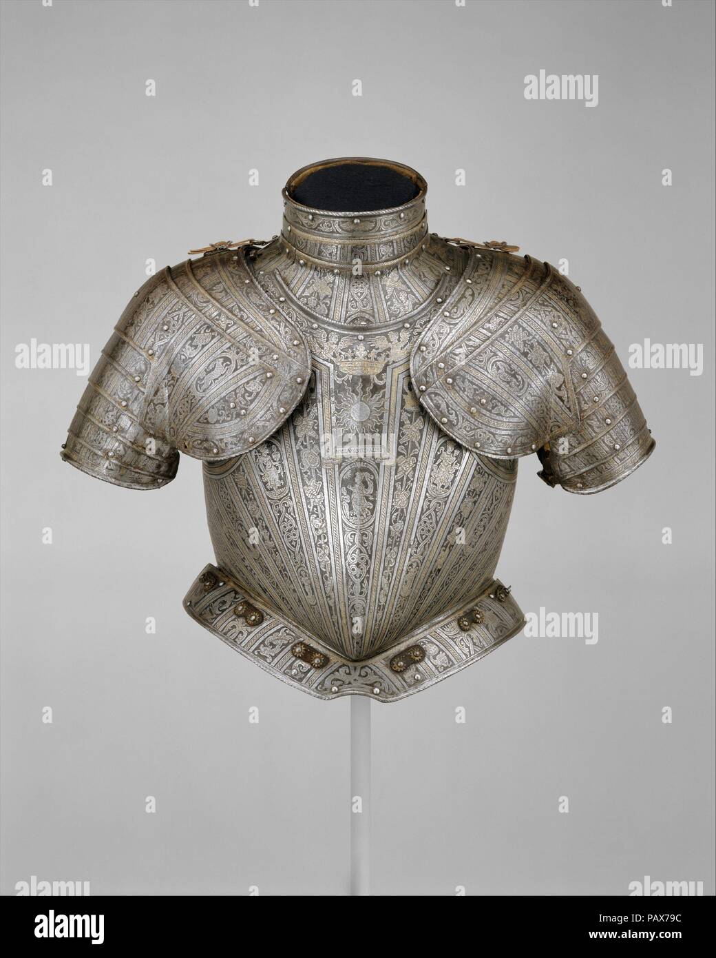 Portions of an Armor for   Vincenzo Luigi di Capua (d. 1627). Armorer: Pompeo della Cesa (Italian, Milan, ca. 1537-1610). Culture: Italian, Milan. Dimensions: H. as mounted 19 in. (48 cm). Date: ca. 1595.  These elements form part of a light-cavalry or infantry armor made for the Neapolitan nobleman Vincenzo Luigi di Capua (d. 1627), count of Altavilla and prince of Riccia. The breastplate bears his personal impresa (emblem), a sunburst above the motto Nulla Quies Alibi (No Repose But Here).  Pompeo della Cesa, whose etched signature 'Pompeo' is found near the top of the breastplate in the cen Stock Photo