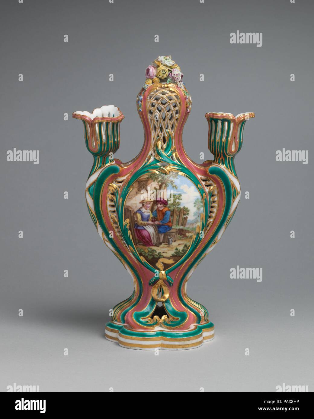 Potpourri vase with candleholders (pot-pourri à bobêche) (one of a pair). Culture: French, Sèvres. Decorator: Figural decoration probably by Charles Nicolas Dodin (French, Versailles 1734-1803 Sèvres); Flower decoration attributed to Pierre-Louis-Philippe (Armand II, called le jeune) (French, working 1746-88, died 1788). Dimensions: Overall (confirmed): 9 1/2 x 6 1/16 x 3 5/8 in. (24.1 x 15.4 x 9.2 cm). Factory: Sèvres Manufactory (French, 1740-present). Modeler: Attributed to Jean-Claude Duplessis (French, ca. 1695-1774, active 1748-74). Date: 1760.  These potpourri vases with candleholders r Stock Photo