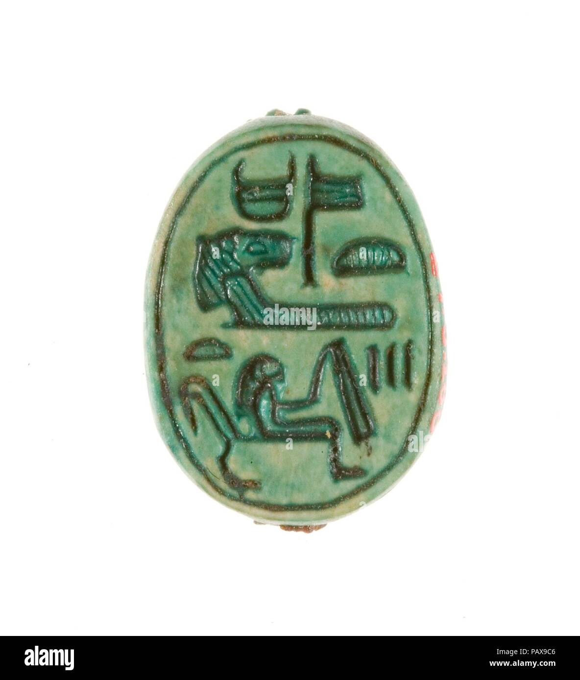 Scarab Inscribed for the God's Wife Hatshepsut. Dimensions: L. 1.7 cm (11/16 in.); W. 1.3 cm (1/2 in.); H. 0.7 cm (1/4 in.). Dynasty: Dynasty 18, early. Reign: Joint reign of Hatshepsut and Thutmose III. Date: ca. 1479-1458 B.C..  This scarab was found in a foundation deposit associated with Hatshepsut's funerary temple at Deir el-Bahri. The base is inscribed with her personal name, Hatshepsut ('foremost of noblewomen') linked with the title God's Wife. Hatshepsut inherited the title while she served as principal queen of her half-brother, Thutmose II. Later in her life, after taking on the ti Stock Photo