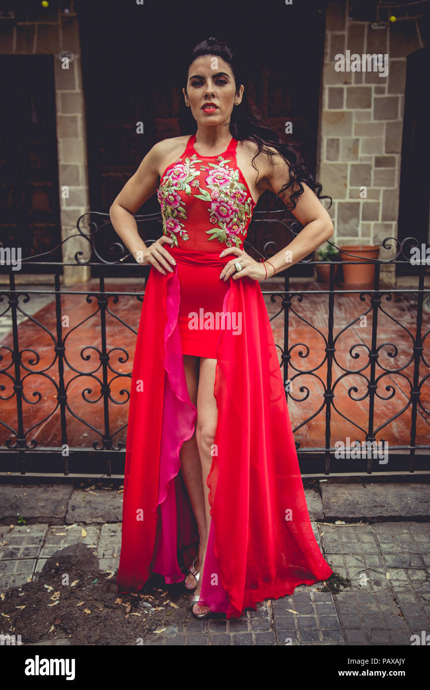 Girl with red dress in garden Stock Photo Alamy