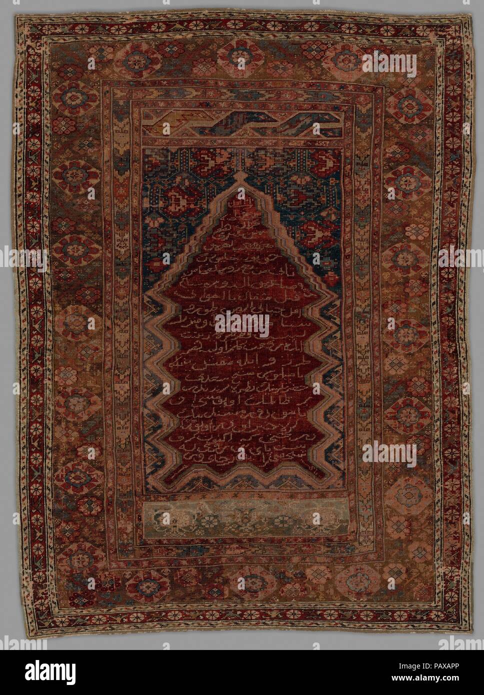 Prayer Rug with Inscription in Niche. Dimensions: H. 62 in. (157.48 cm)  W. 48 in. (121.92 cm). Date: dated A.H. 1210/A.D. 1795-96. Museum: Metropolitan Museum of Art, New York, USA. Stock Photo