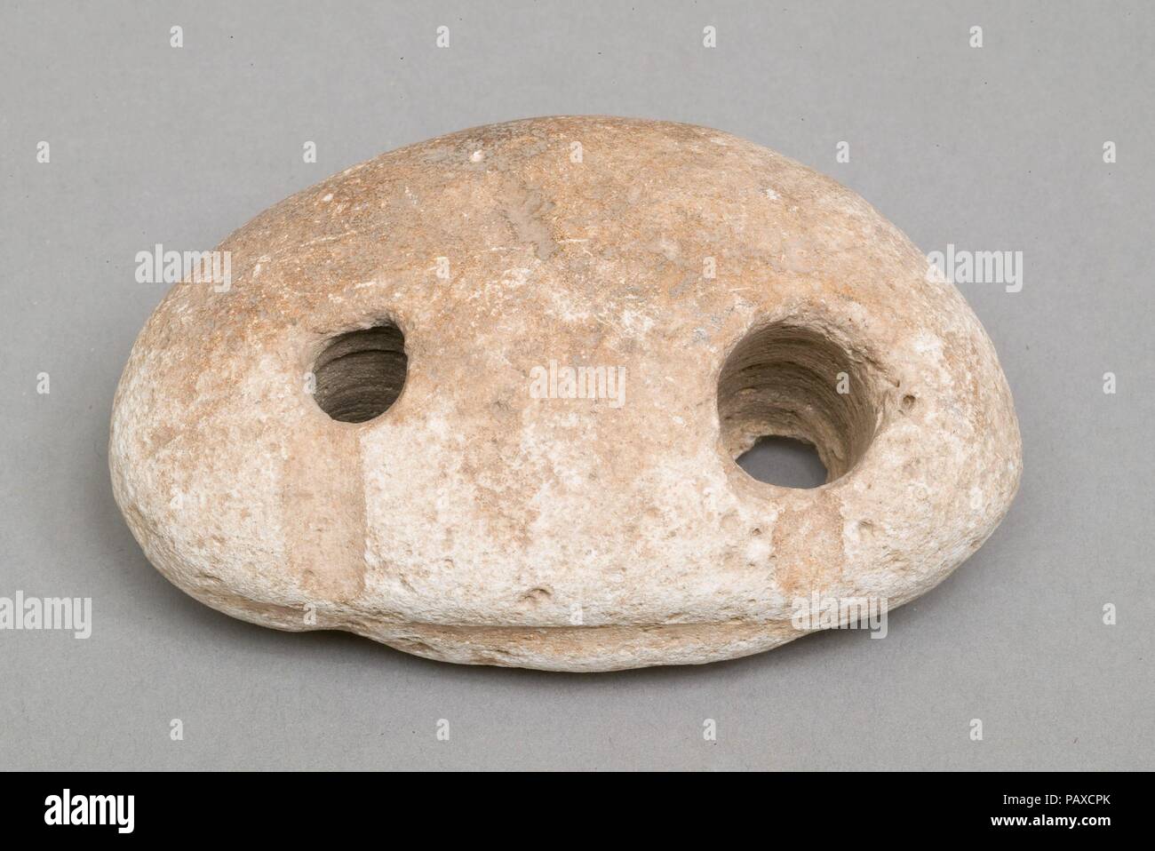 Weighing down device (fish net sinker?). Dimensions: l. 10.1 cm (4 in). Dynasty: Dynasty 19-20. Date: ca. 1295-1070 B.C.. Museum: Metropolitan Museum of Art, New York, USA. Stock Photo