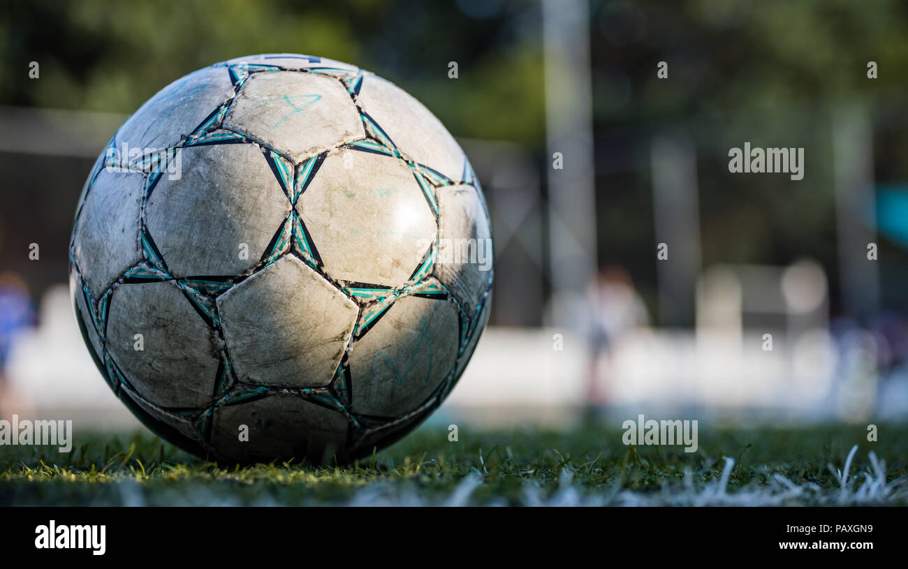 Football concept. A football soccer ball set on the field, isolated, with copy space in a blurry background, wallpaper Stock Photo - Alamy Football concept. A football soccer ball set on the field, isolated, with copy space in a blurry background, wallpaper Stock Photo - Alamy